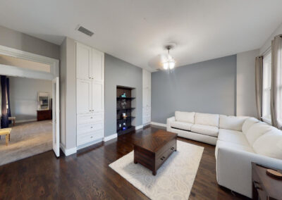 Master bedroom lounge with sectional sofa and built-ins at Saint Patrick Palace
