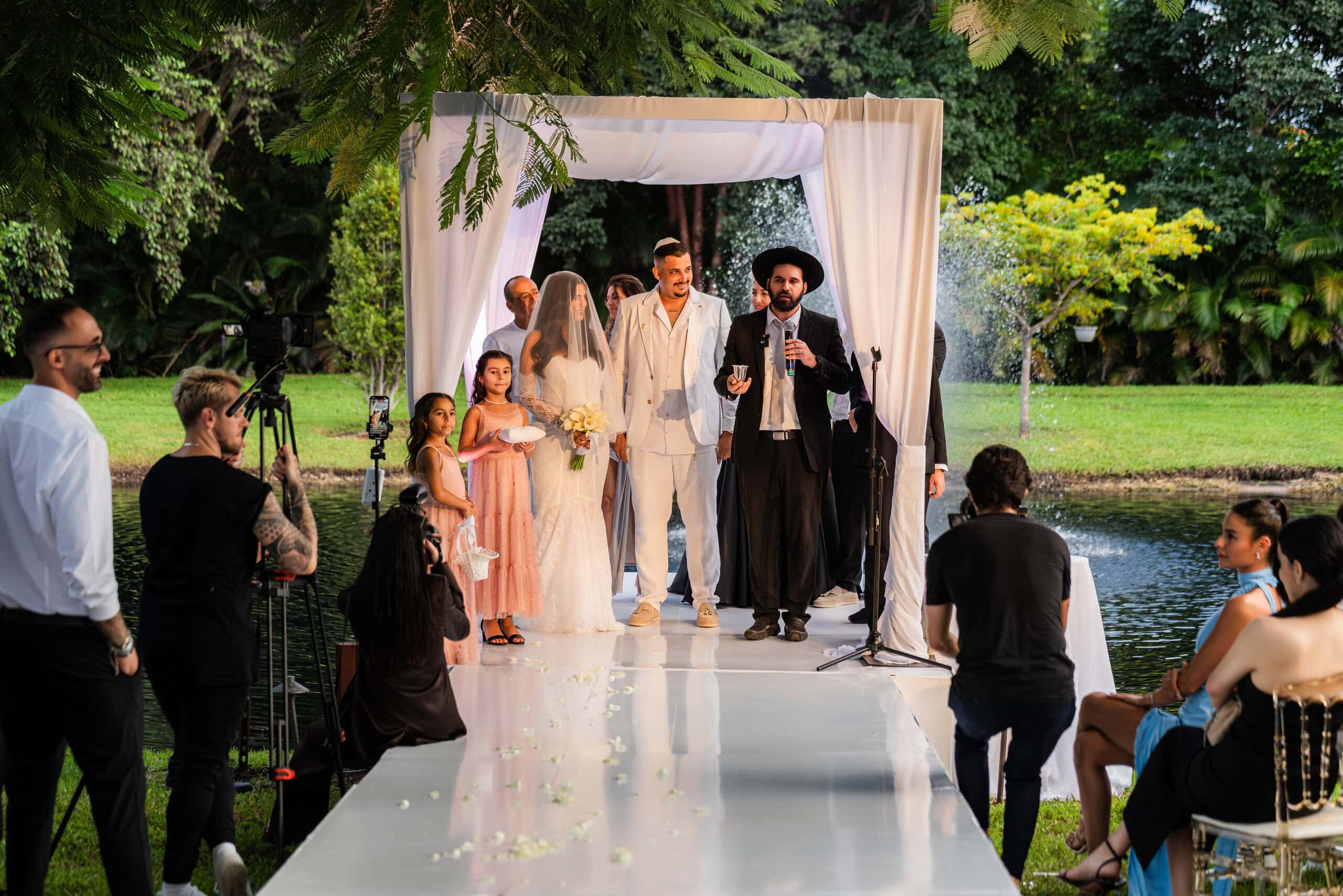 Jewish wedding ceremony under chuppah with rabbi officiating waterfront wedding at Saint Patrick Palace