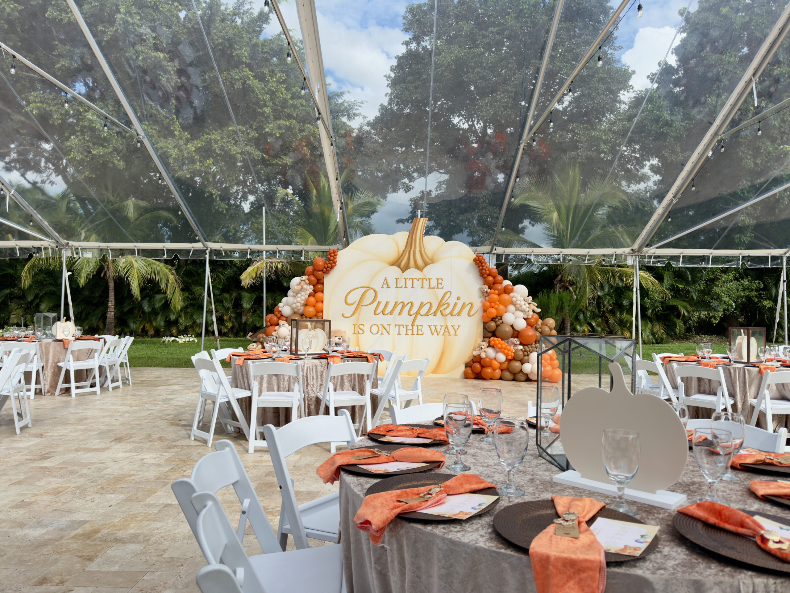 Little Pumpkin themed outdoor baby shower under a clear tent at Saint Patrick Palace