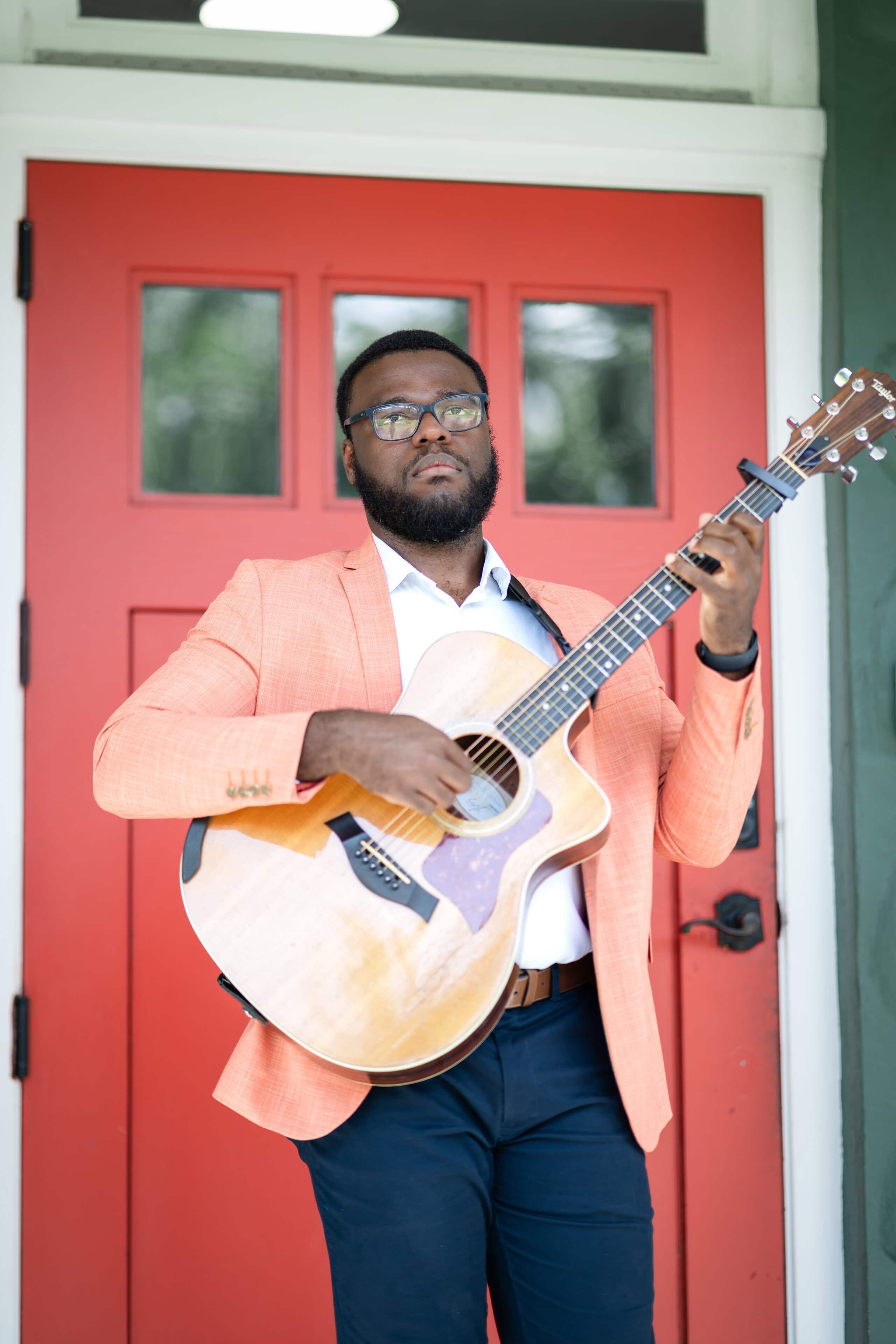 Live acoustic guitarist performing during a wedding weekend event at Saint Patrick Palace.