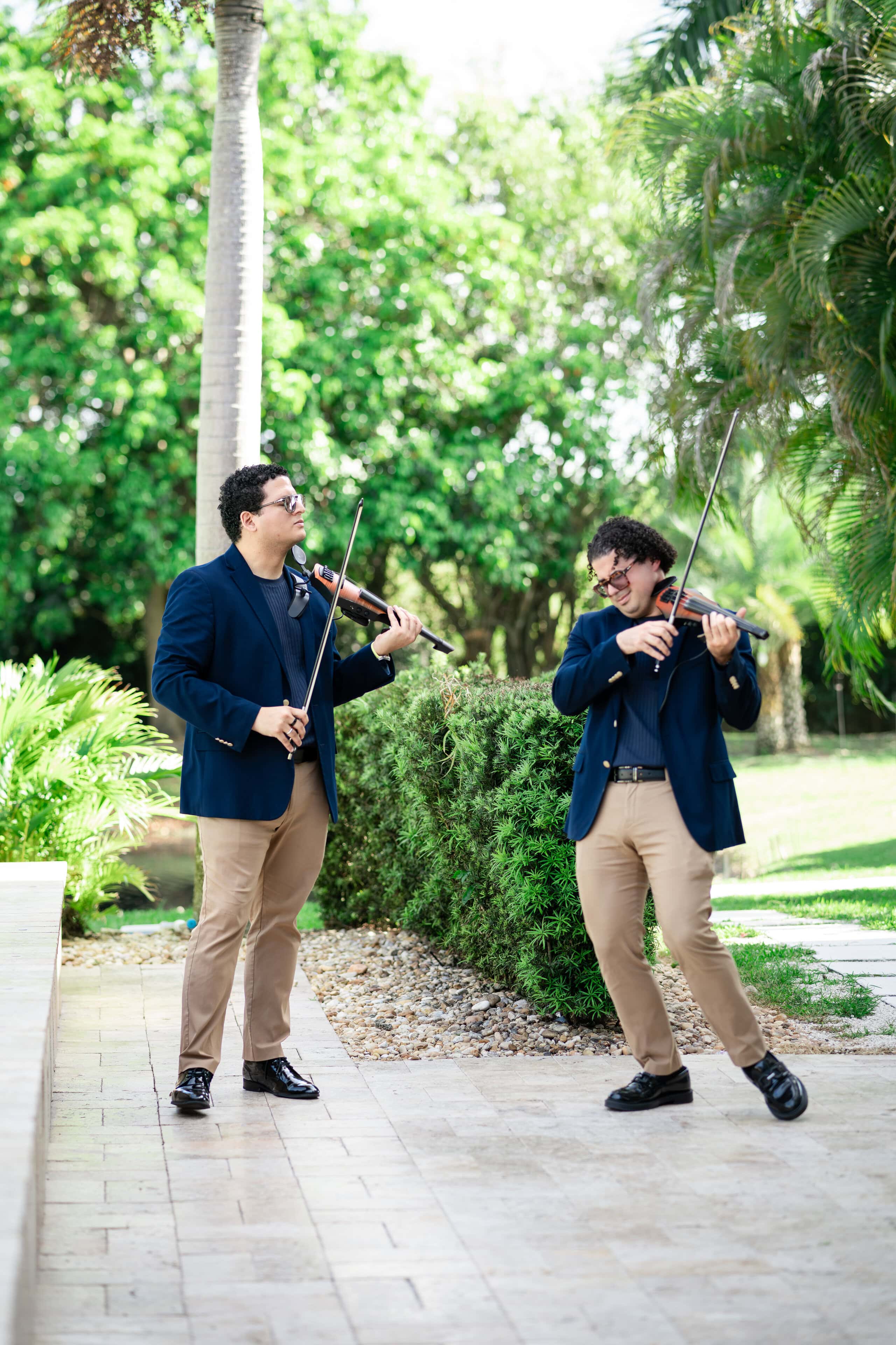 Live violinists performing during a wedding weekend celebration in South Florida.