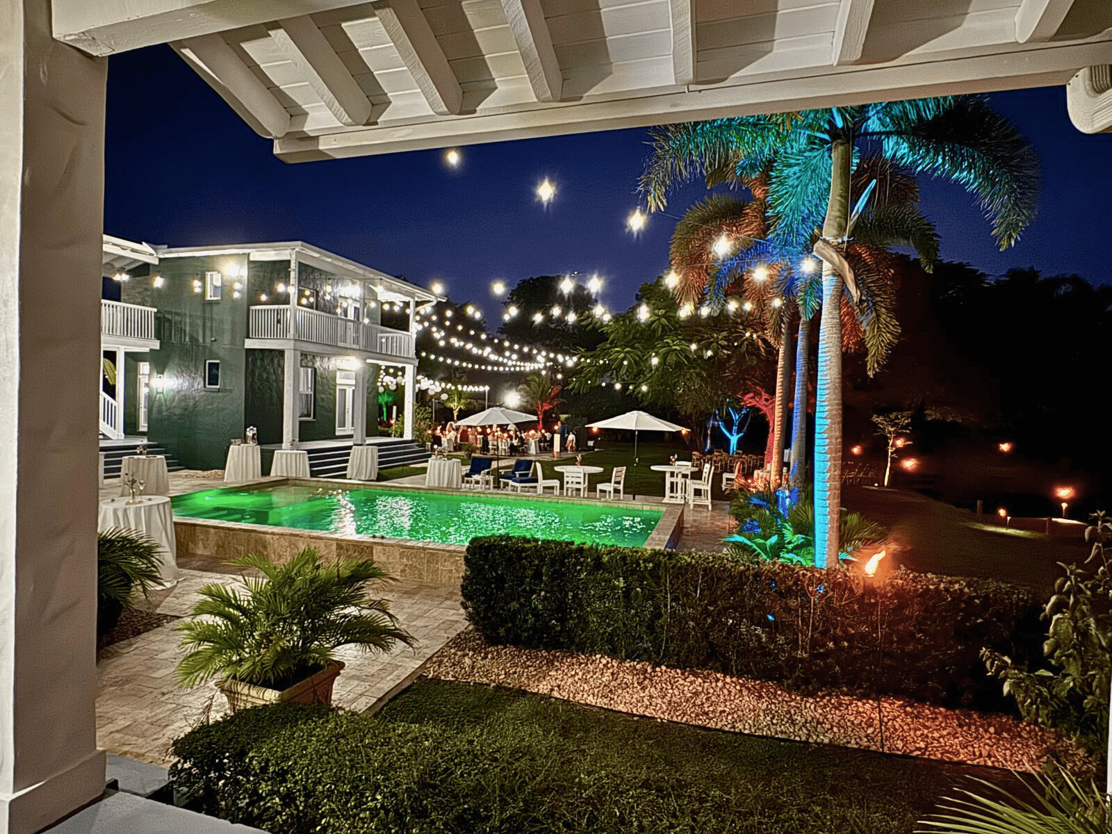 Luxury poolside wedding venue with glowing lights at South Florida private estate.