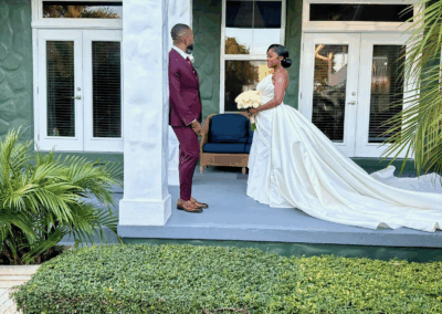 Bride and groom on the porch during a luxury South Florida private estate wedding.