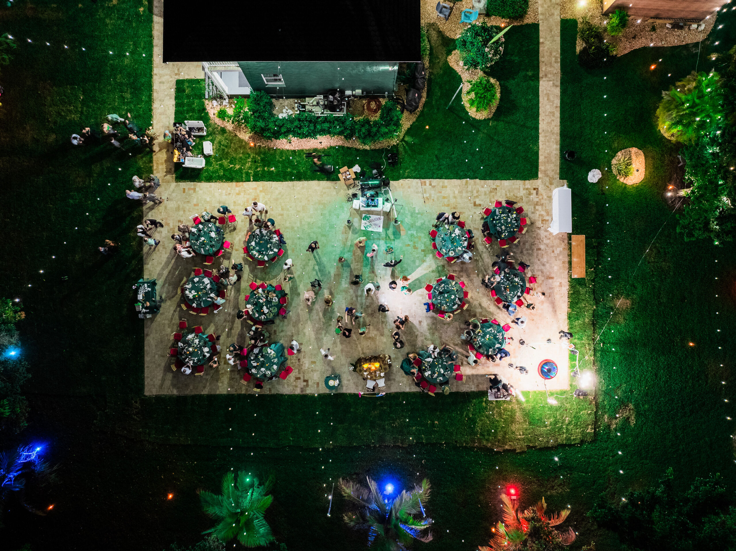 Night aerial view of outdoor wedding reception at Saint Patrick Palace in Davie, Florida.