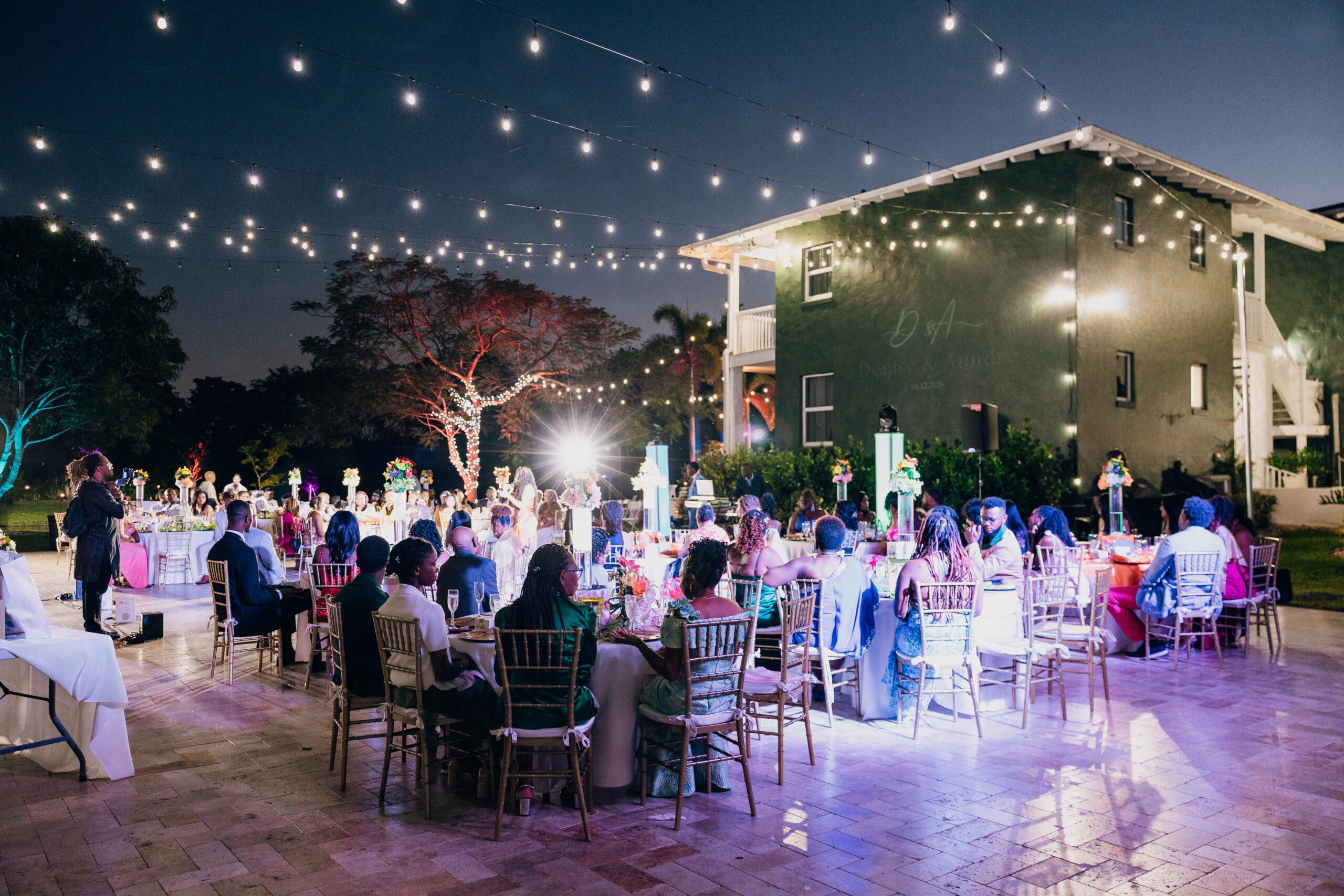 Elegant outdoor brunch celebration with string lights and colorful décor at Saint Patrick Palace.