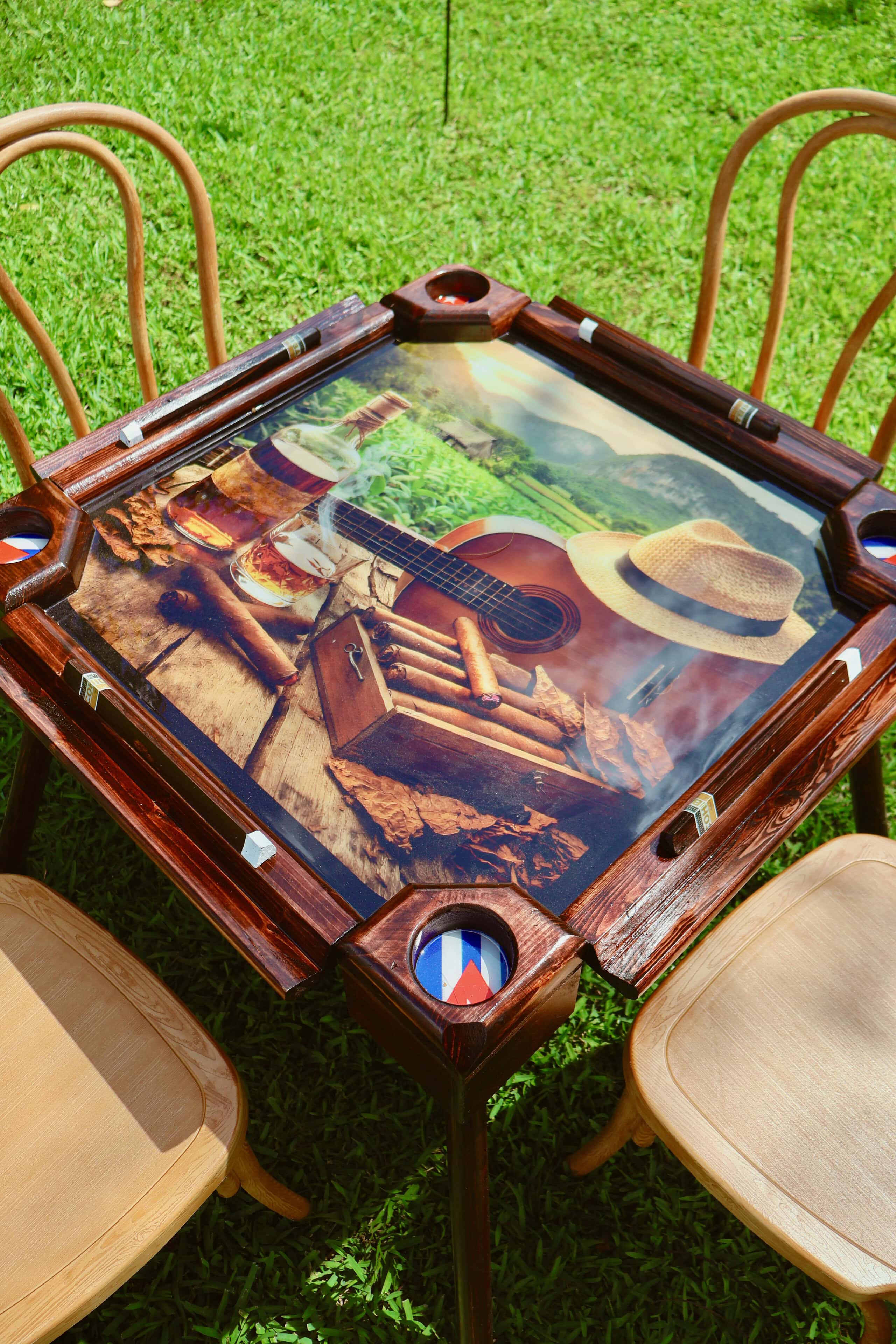 Outdoor cigar lounge with domino table and seating at private estate wedding in Davie Florida