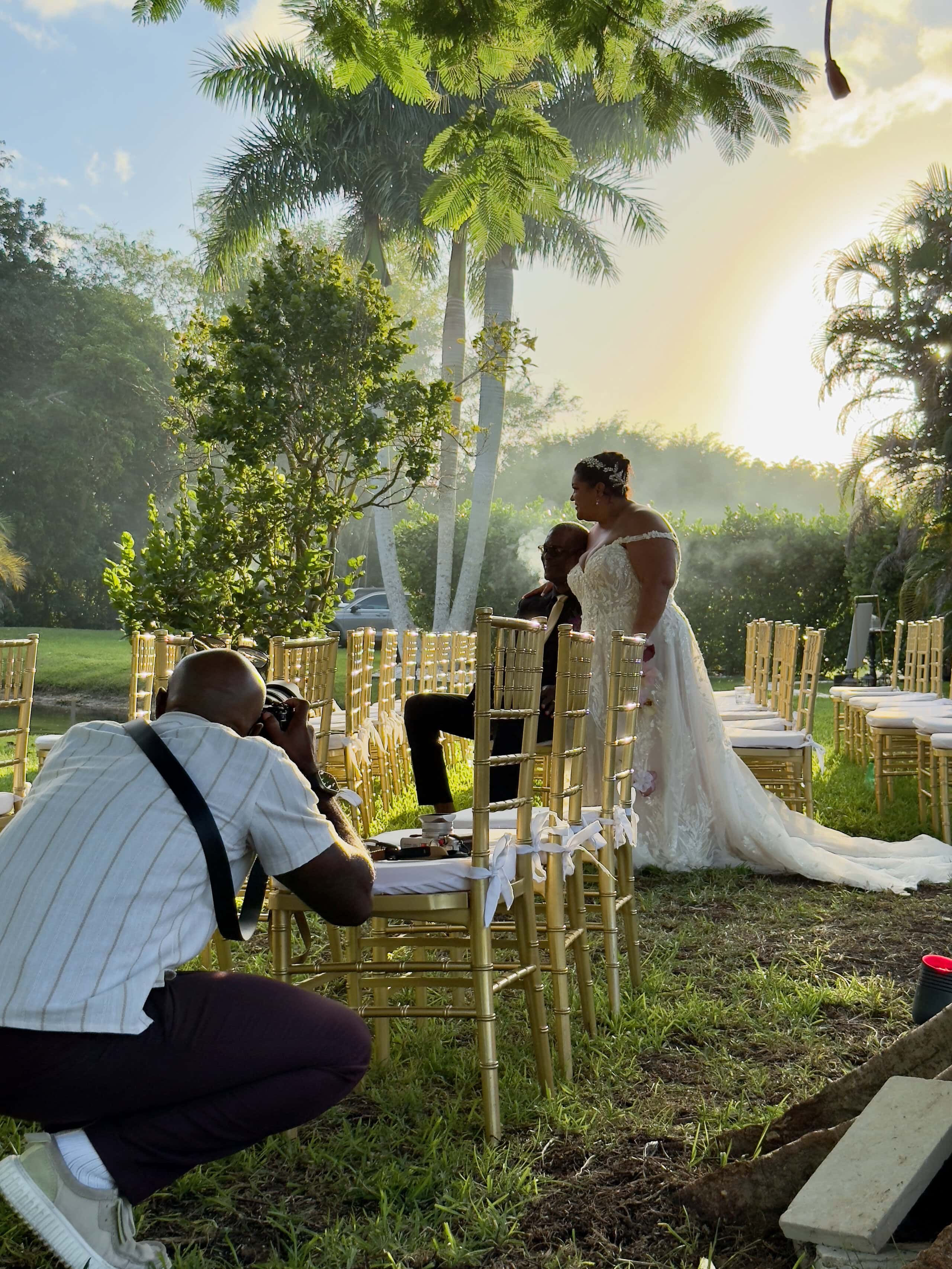 Photographer capturing outdoor wedding ceremony with open vendor flexibility at Saint Patrick Palace golden hour setting