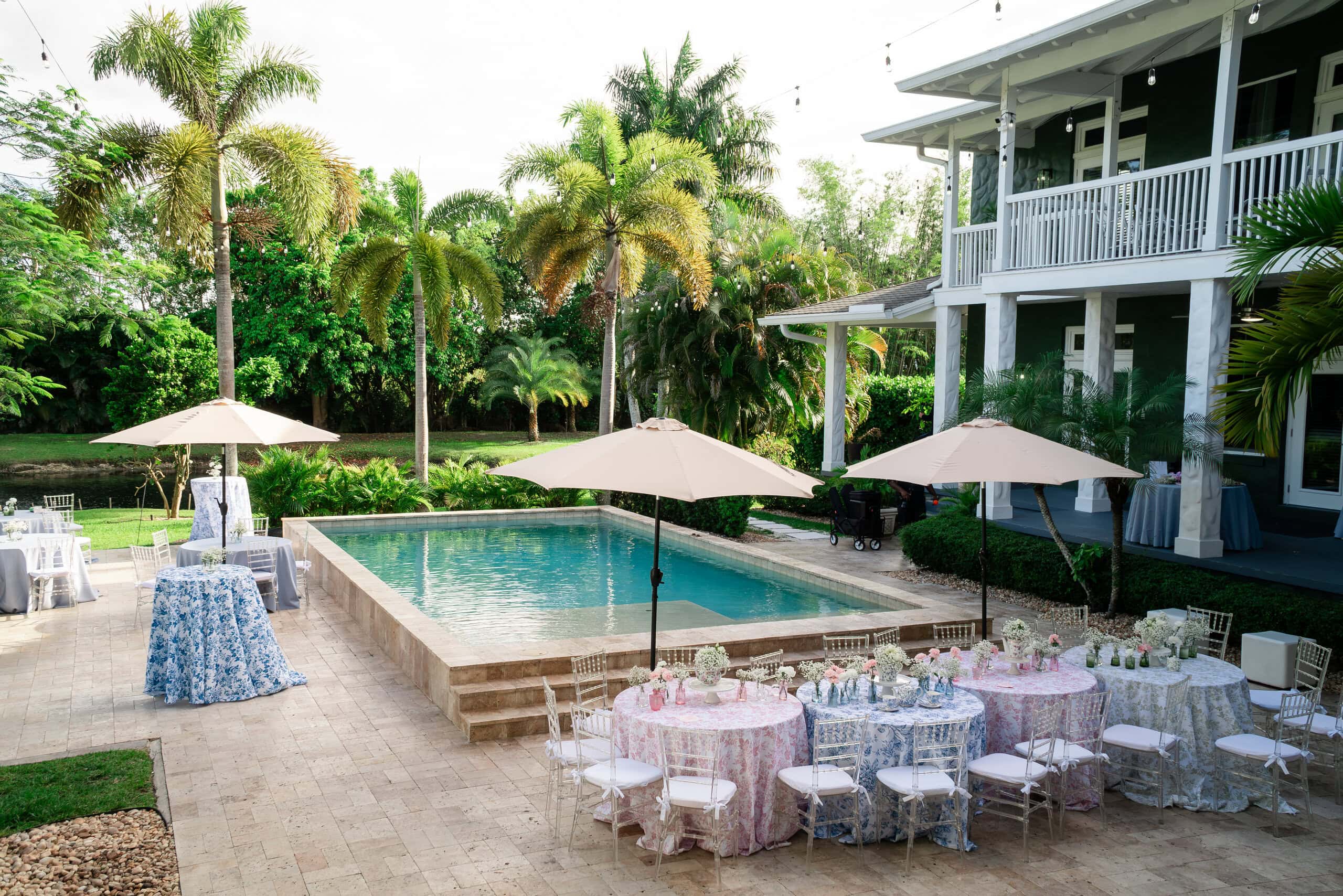 Elegant poolside wedding brunch setup at Saint Patrick Palace in South Florida.