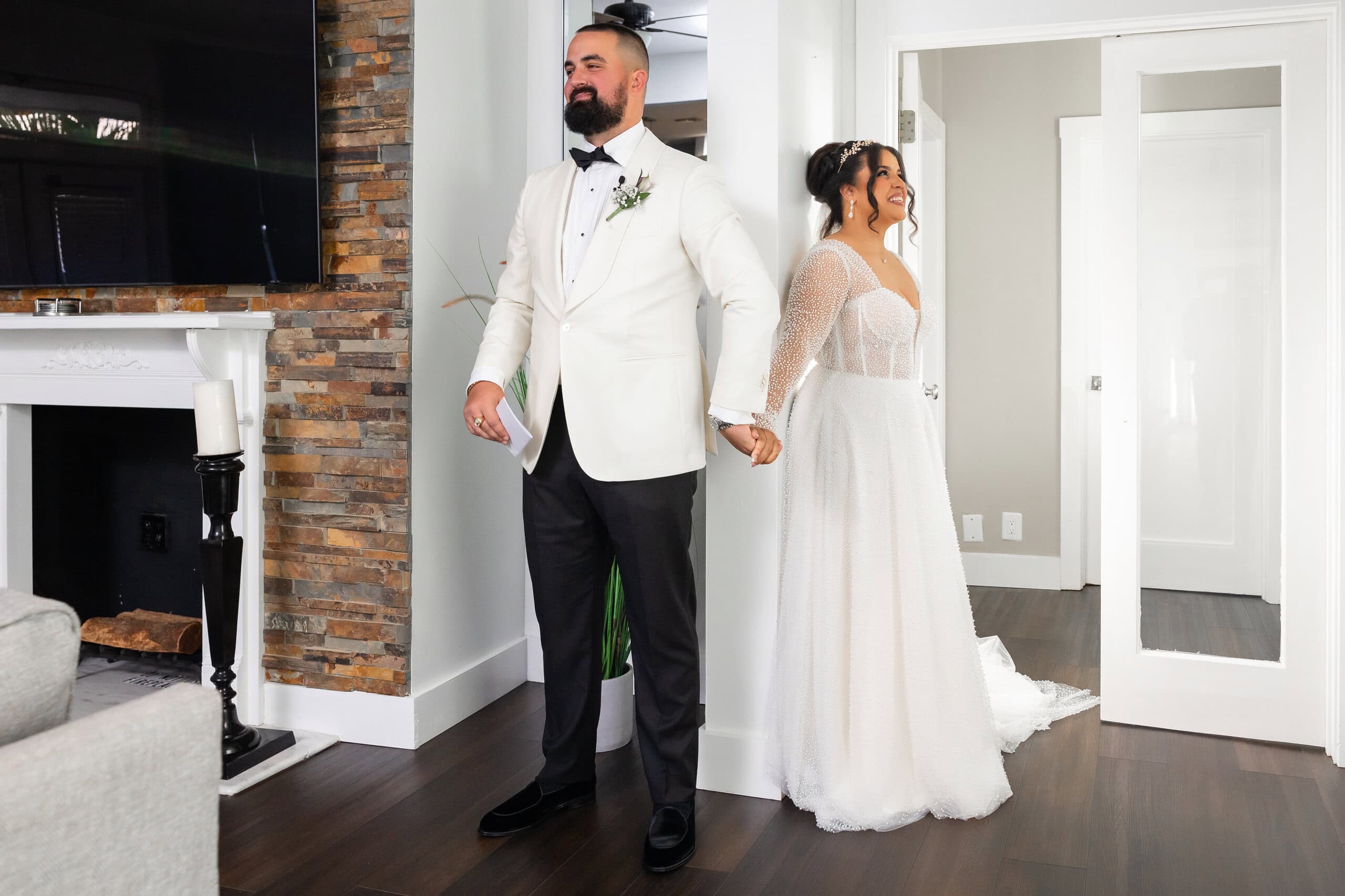 Bride and groom sharing a private first look inside Saint Patrick Palace before their South Florida wedding ceremony.