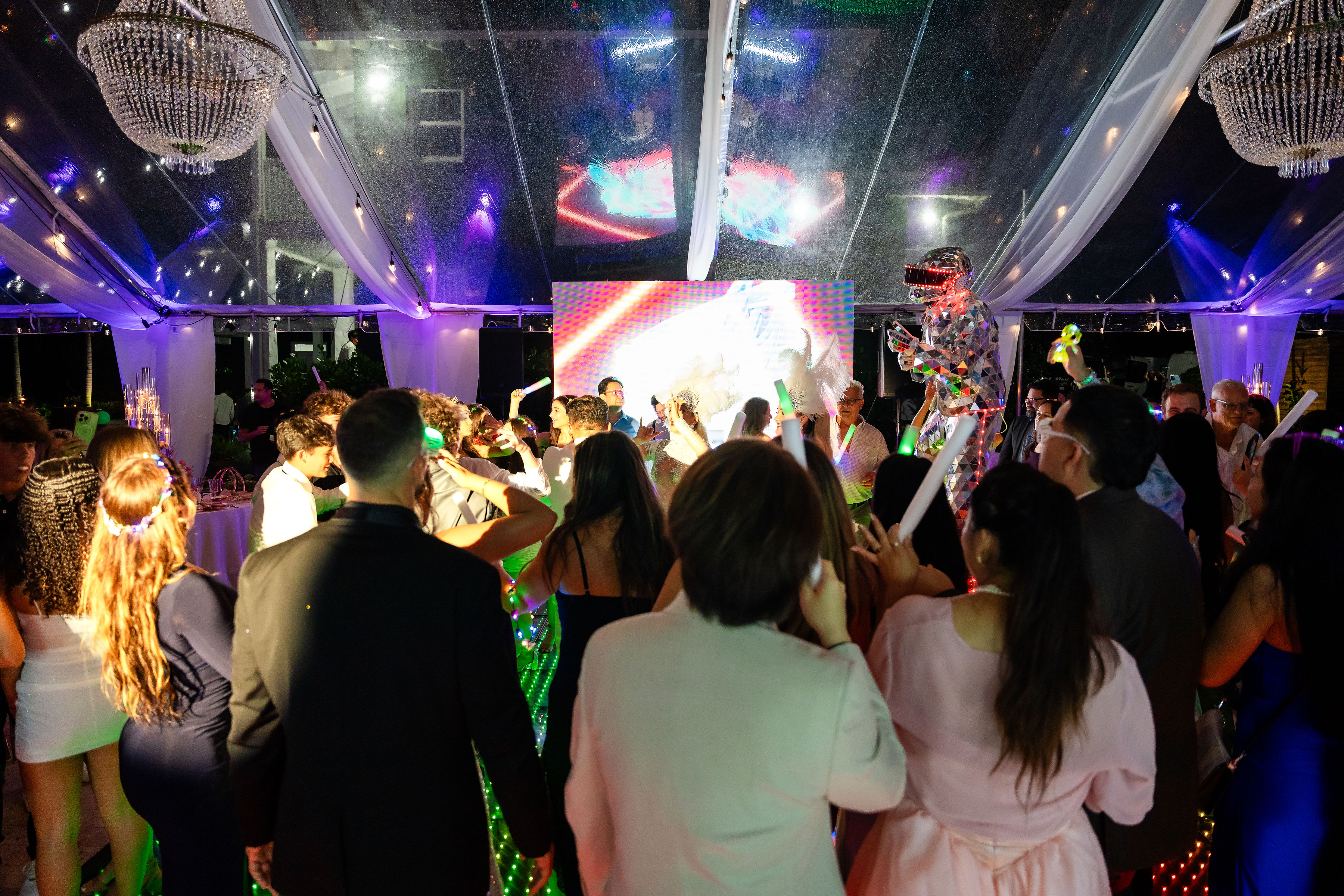 LED robot performer entertaining guests on the dance floor during a rose gold quinceañera at Saint Patrick Palace.