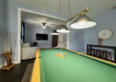 Saint Patrick Palace billiards room with pool table and bar seating