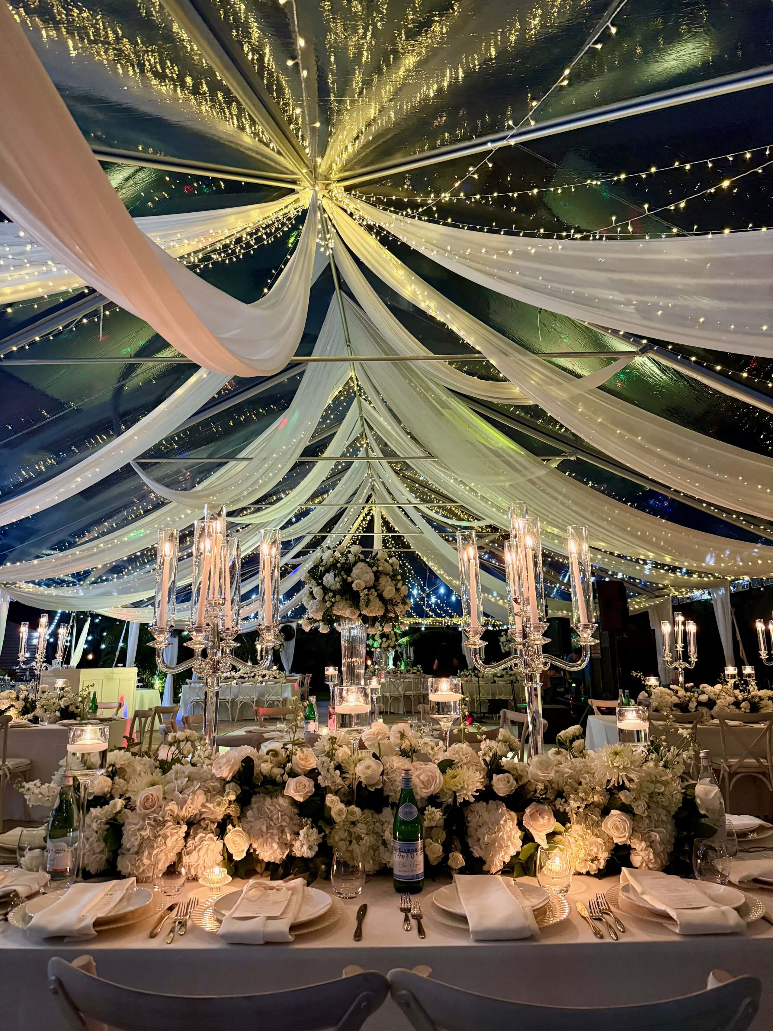 Luxurious decorated event space with draped fabric and fairy lights at Saint Patrick Palace.
