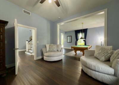 Saint Patrick Palace lounge with plush seating and pool table