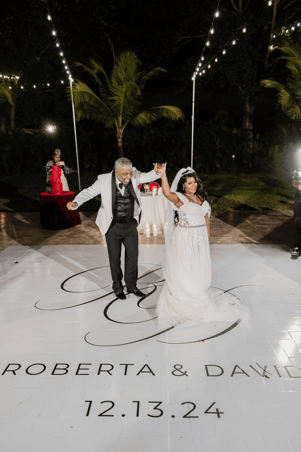 Bride and groom first dance at night under string lights at Saint Patrick Palace private estate wedding in South Florida