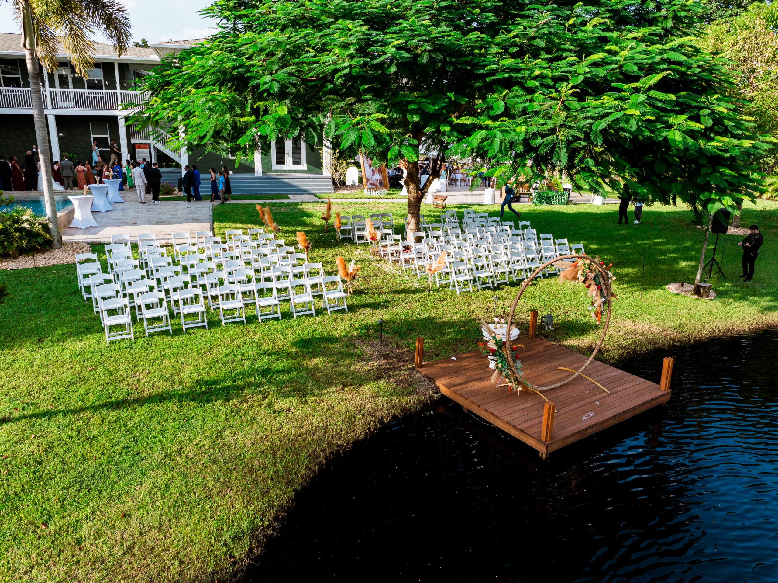 Outdoor wedding ceremony setup at Saint Patrick Palace, South Florida — promoting a wedding glossary blog for couples.