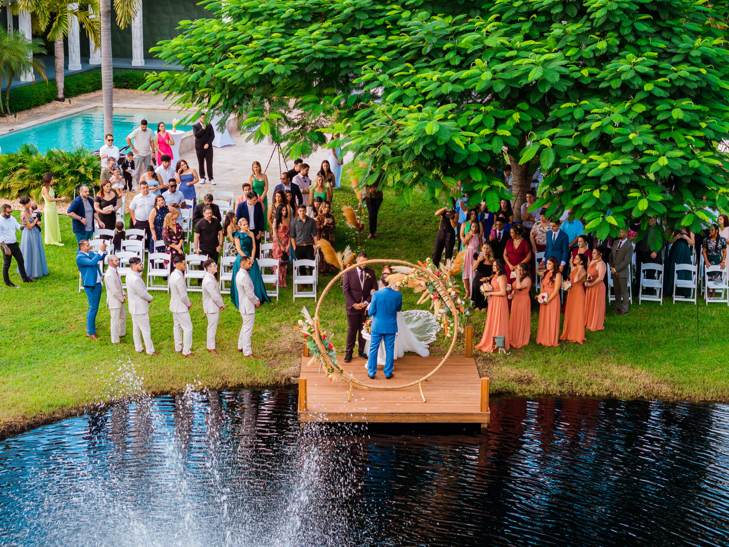 Outdoor wedding ceremony at Saint Patrick Palace in South Florida, promoting a glossary of wedding terms for couples.