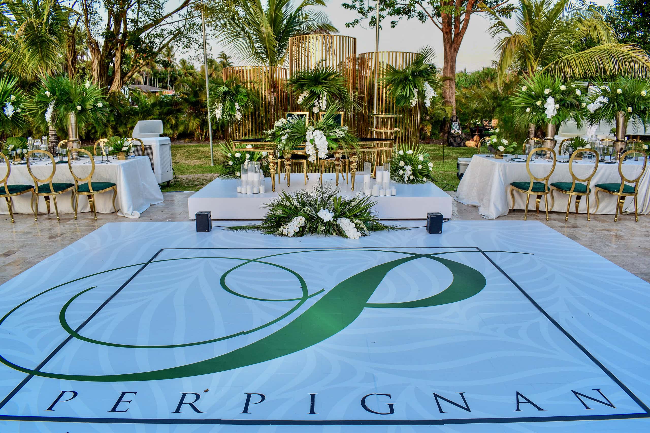 South Florida spring wedding with a custom dance floor, tropical florals, and an elegant outdoor reception.