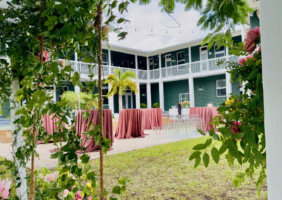 View of Saint Patrick Palace courtyard framed by floral swing greenery.