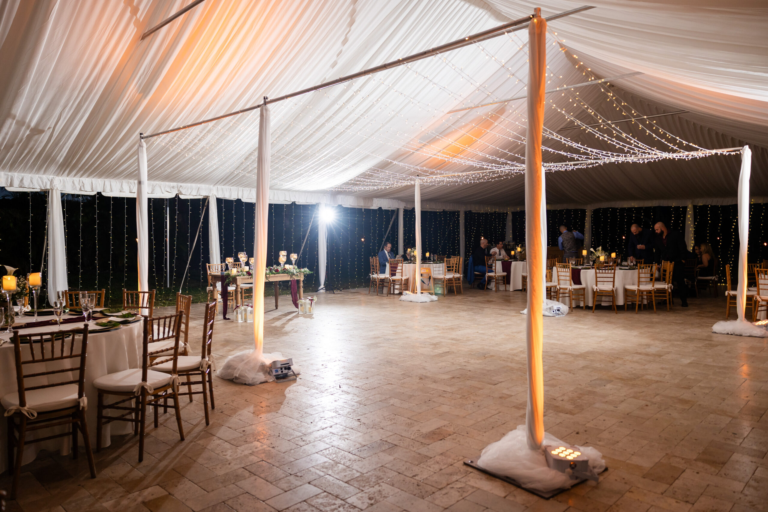 Tented wedding reception at Saint Patrick Palace in South Florida, promoting a wedding glossary blog for couples.