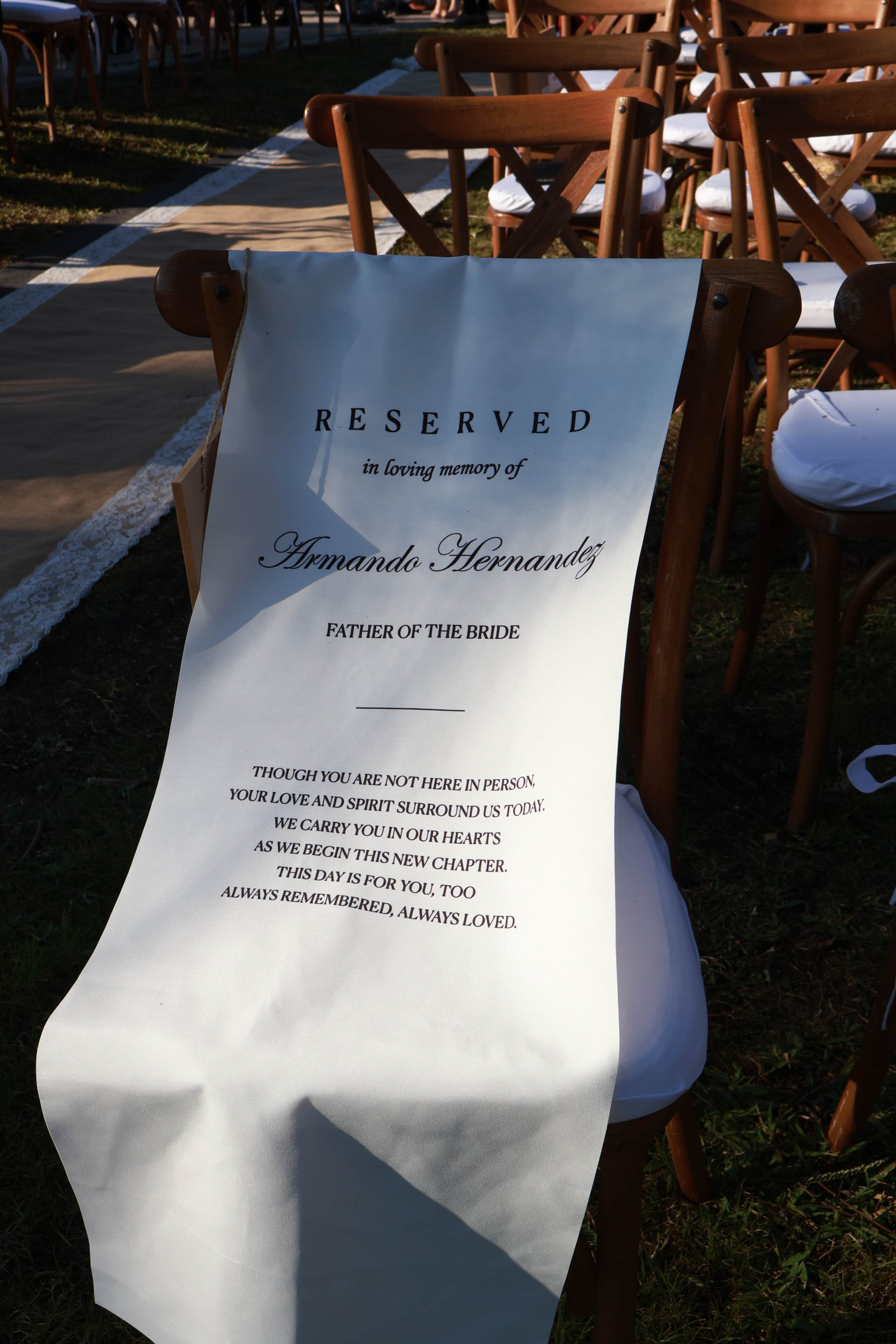 Reserved memorial chair with sign at wedding ceremony Saint Patrick Palace