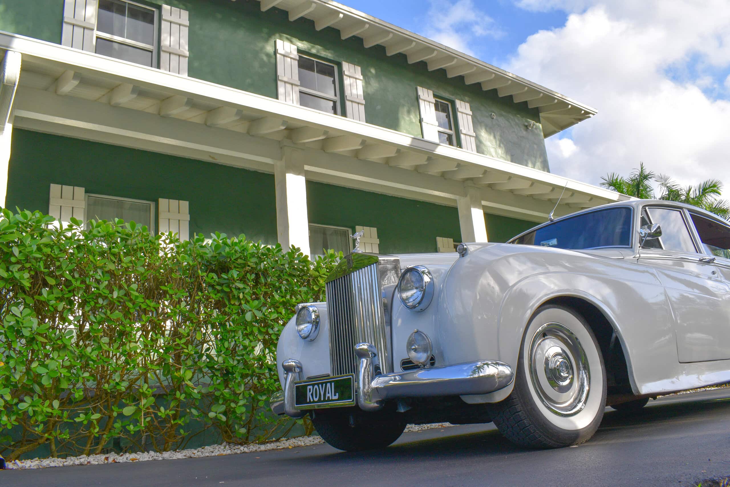 Vintage Rolls Royce parked at private estate wedding venue for luxury wedding prelude arrival experience in South Florida