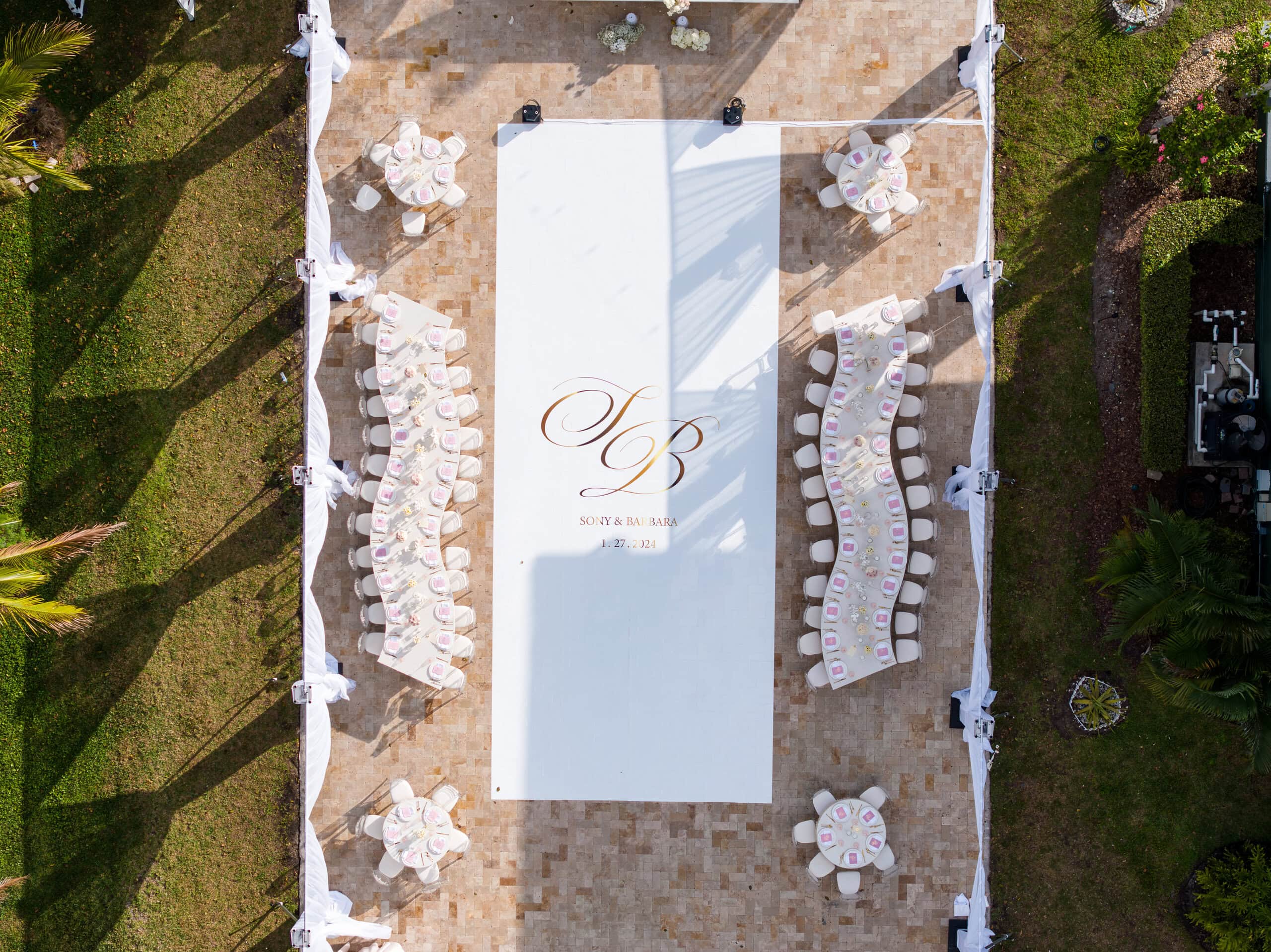 Overhead view of wedding reception layout with custom dance floor and table design at private estate venue in South Florida